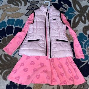 Bundled this cute used pink dress with hearts and Calvin Klein puffer vest .